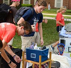 Photo of students moving in to residence hall